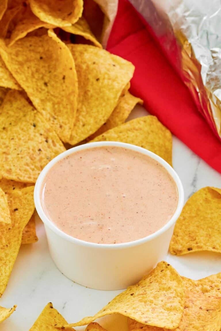 Copycat Chipotle adobo ranch in a small bowl and corn tortilla chips.