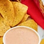 A bowl of copycat Chipotle adobo ranch and corn tortilla chips.
