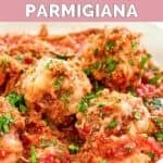 Homemade Olive Garden meatballs parmigiana with fresh parsley sprinkled on top.