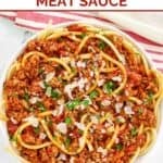 A bowl of homemade Olive Garden spicy three meat sauce with bucatini.