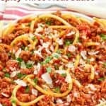 Homemade Olive Garden spicy three meat sauce served with thick spaghetti.