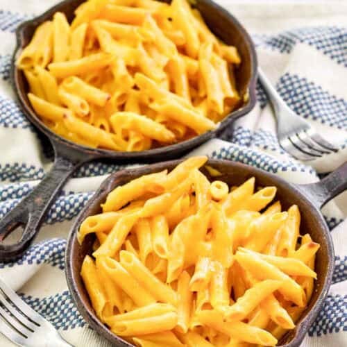 Copycat Outback Steakhouse mac and cheese in small cast iron skillets.