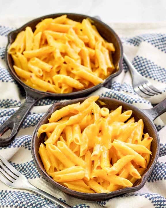 Copycat Outback Steakhouse mac and cheese in small cast iron skillets.