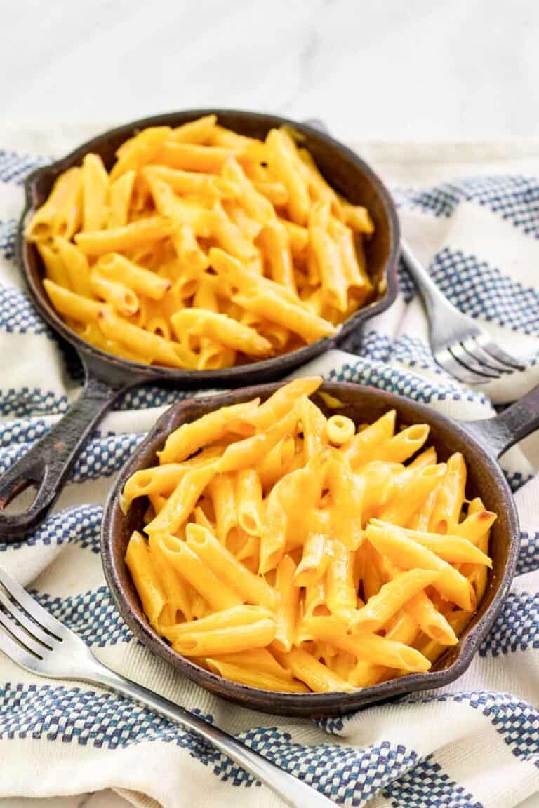 Copycat Outback Steakhouse mac and cheese in small cast iron skillets.