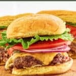 Homemade Smashburger classic smash burgers on a serving board.