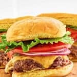Homemade Smashburger classic smash burgers on a wood board.