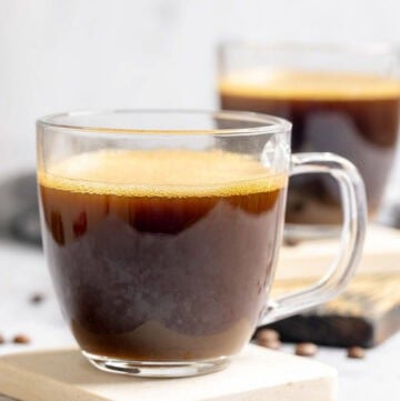 Copycat Starbucks Americano drinks on coasters.