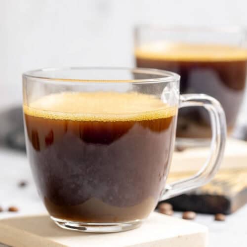 Copycat Starbucks Americano drinks on coasters.