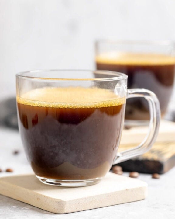 Copycat Starbucks Americano drinks on coasters.