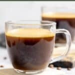 Homemade Starbucks americano coffee drinks in glass mugs on coasters.