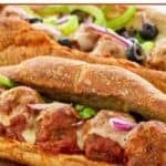 Homemade Subway meatball sub sandwiches with fresh veggie toppings.