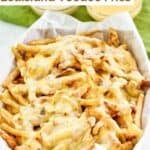 Homemade Wingstop Louisiana voodoo fries on parchment in a serving basket.