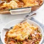 Homemade Cheesecake Factory shepherd's pie serving with the pie behind it.