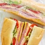 Homemade Kmart deli sub sandwiches on parchment paper.