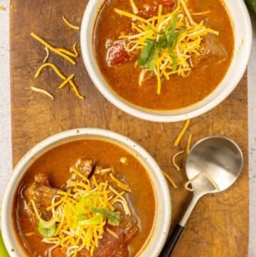 Lady Bird Johnson's Pedernales River chili in several bowls and a spoon next to them.