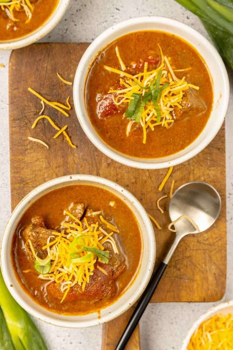 Lady Bird Johnson's Pedernales River chili in several bowls and a spoon next to them.