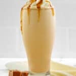 Copycat McDonald's caramel frappe drink on a marble surface.