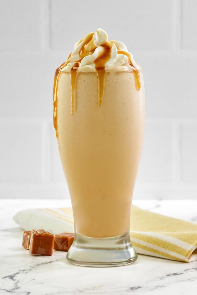 Copycat McDonald's caramel frappe drink on a marble surface.