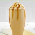 Homemade McDonald's caramel frappe, caramel candies, and kitchen towel.