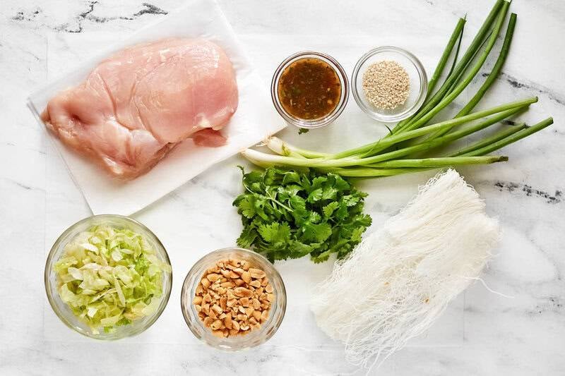 Copycat Ming's Thai chicken salad ingredients on a marble surface.