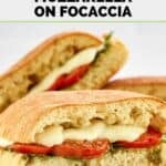 Homemade Starbucks sandwich with roasted tomato, mozzarella, pesto, and spinach on focaccia.