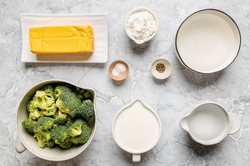 Copycat Black-eyed Pea broccoli cheese soup ingredients on a marble surface.