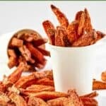 Homemade Five Guys Cajun fries served in large cups.