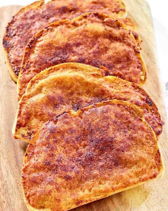 Copycat North Woods Inn garlic cheese bread on a wood serving board.