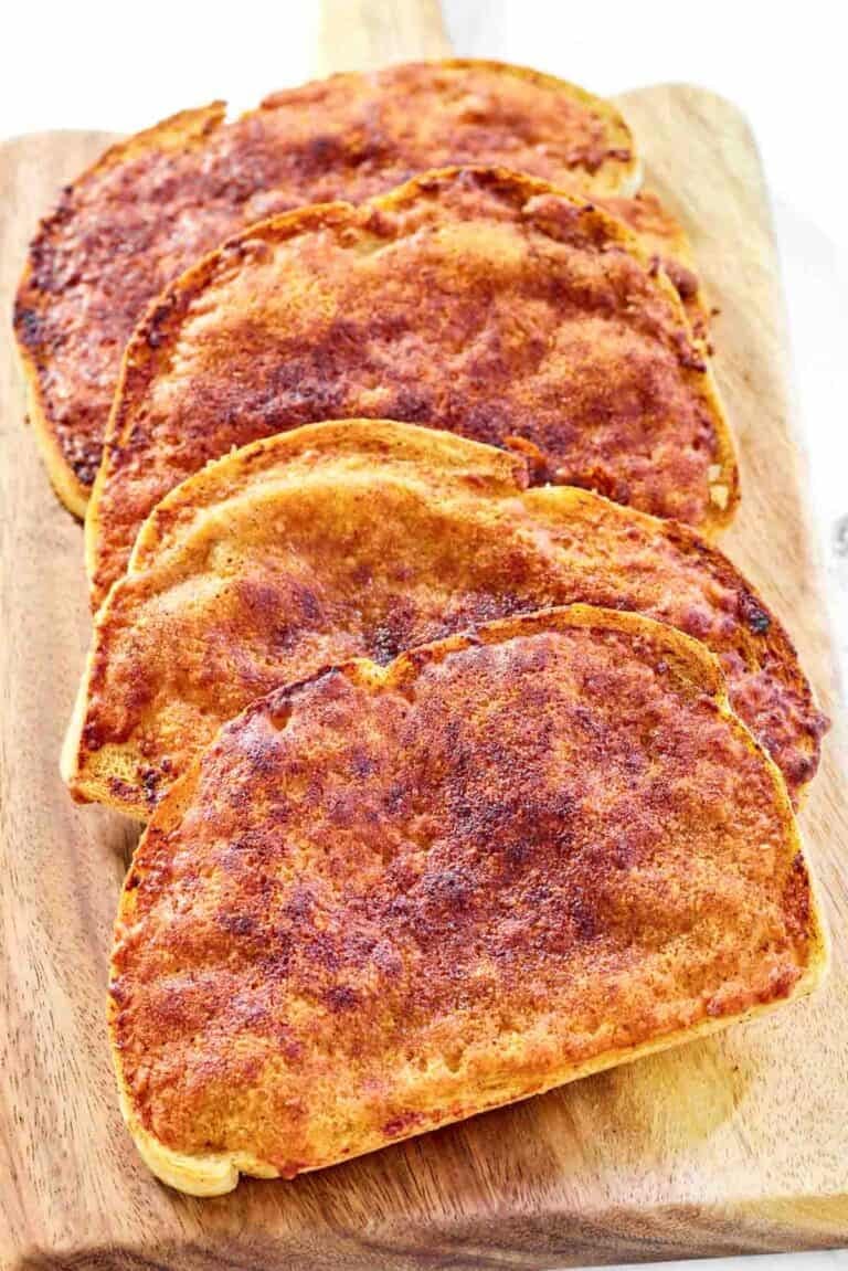 Copycat North Woods Inn garlic cheese bread on a wood serving board.