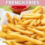 Homemade Wingstop seasoned French fries on parchment paper in a paper basket.