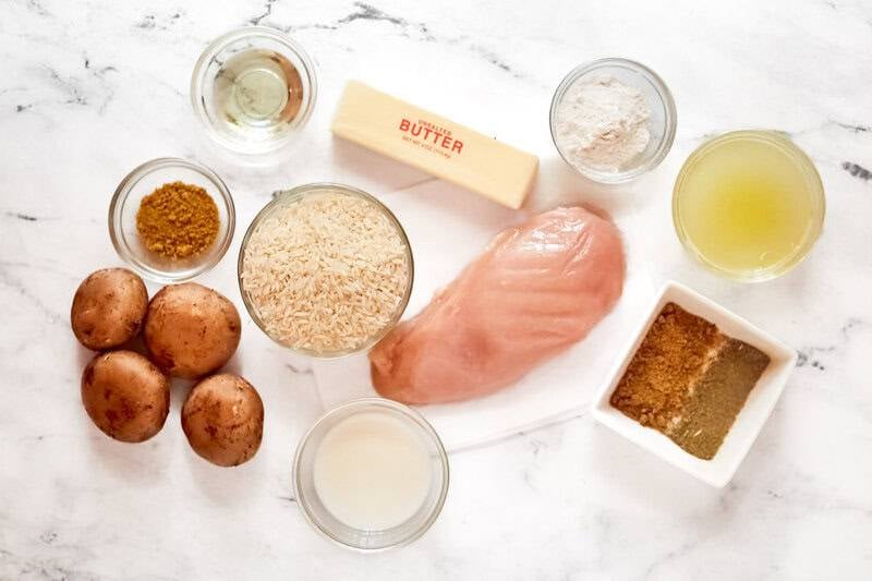 Copycat Cracker Barrel chicken and rice ingredients on a marble surface.