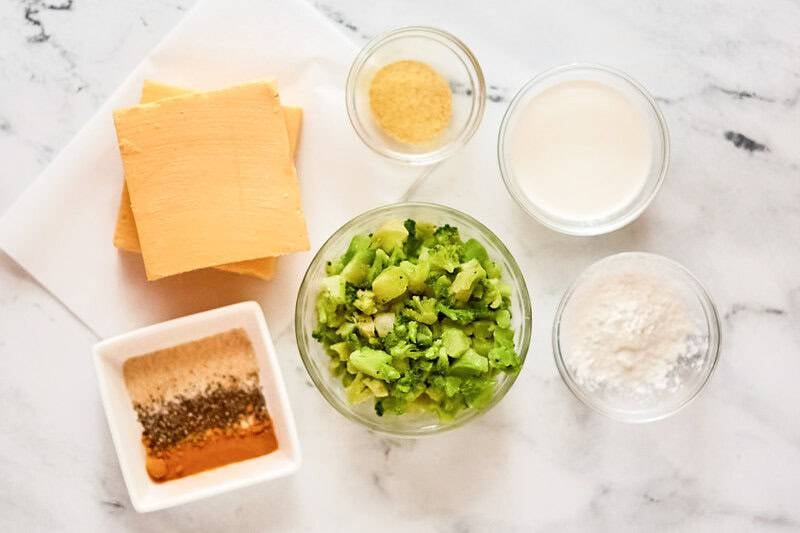 Copycat Jason's Deli broccoli cheese soup ingredients on a marble surface.