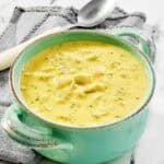 Copycat Jason's Deli broccoli cheese soup in a bowl on a marble surface.