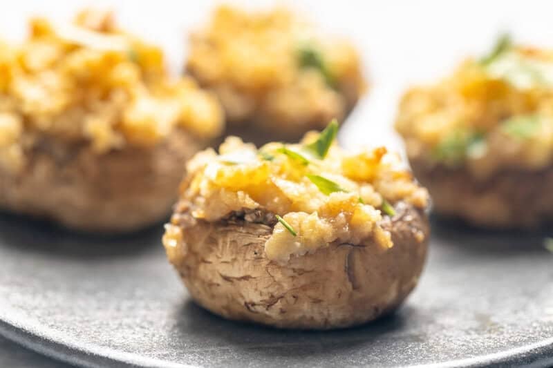 Homemade stuffed mushrooms made with Ritz crackers on a platter.