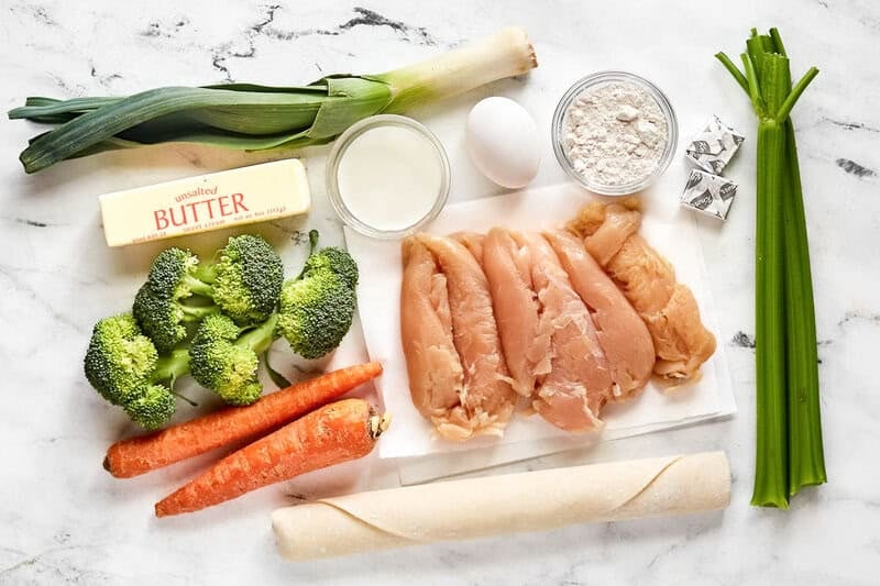 Chicken, vegetables, butter, milk, egg, four, bouillon, and pie crust.