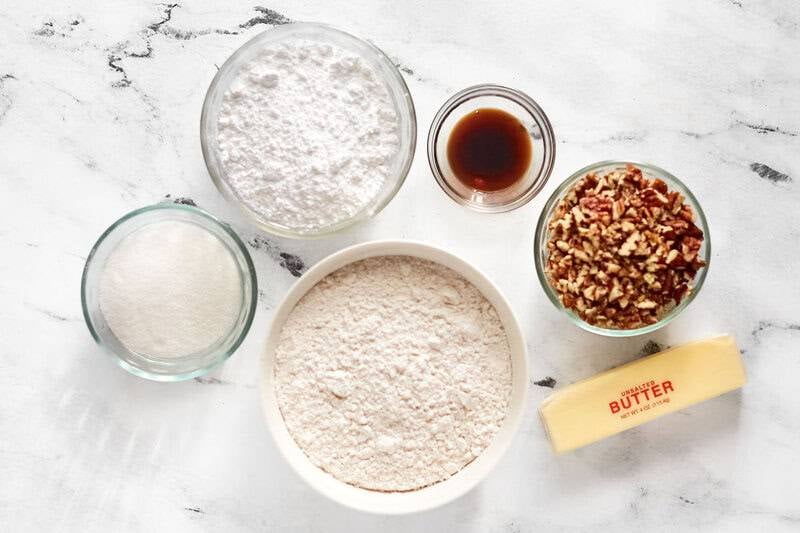 Copycat David's cookies butter pecan meltaways ingredients on a marble surface.