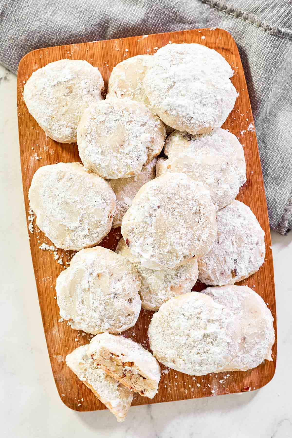 Copycat David's cookies butter pecan meltaways piled on a small platter.