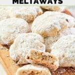 A pile of homemade David's cookies butter pecan meltaways on a wood board.