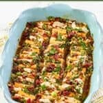 Sundried tomato marinated cheese slices in a serving dish.