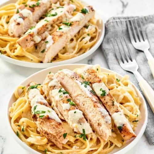 Two servings of copycat Olive Garden grilled chicken alfredo.