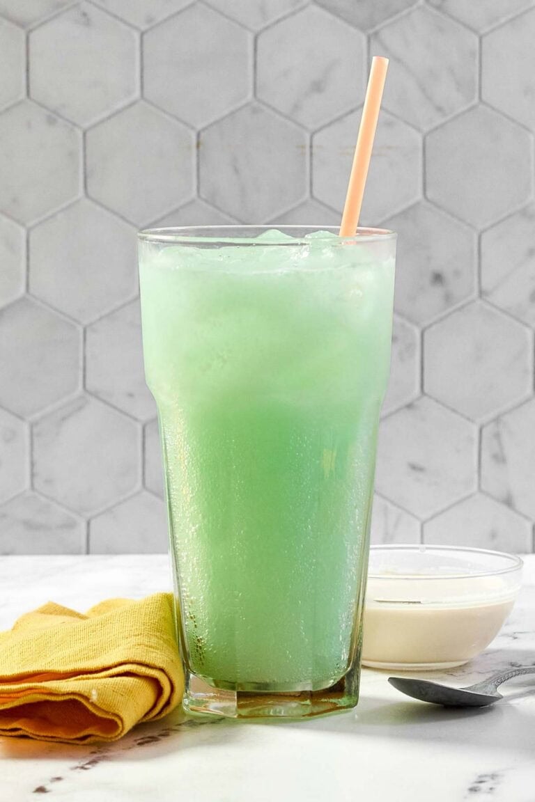 A glass of copycat Taco Bell Dirty Mountain Dew Baja Blast dream soda.
