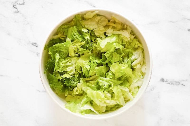 A bowl of chopped lettuces to make Texas Roadhouse house salad.