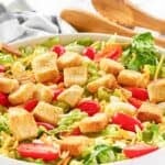 A large bowl of homemade Texas Roadhouse house salad.