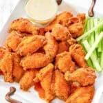 Copycat Wings and Things garlic buffalo wings on a platter.