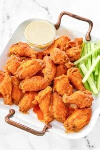 Copycat Wings and Things garlic buffalo wings on a platter.