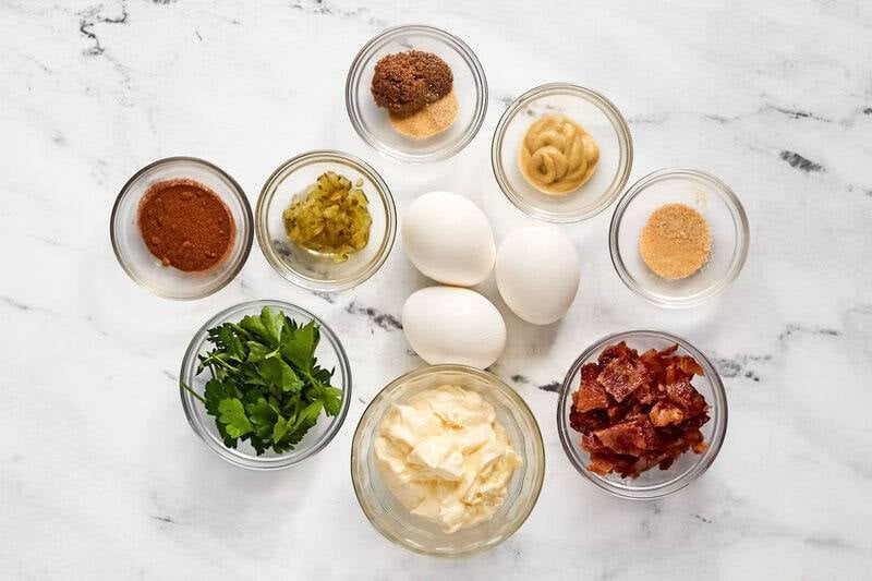 Hard-boiled eggs, mayonnaise, mustard, bacon bits, and seasonings.
