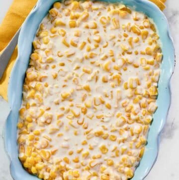 Creamy corn dish in an elegant serving dish.