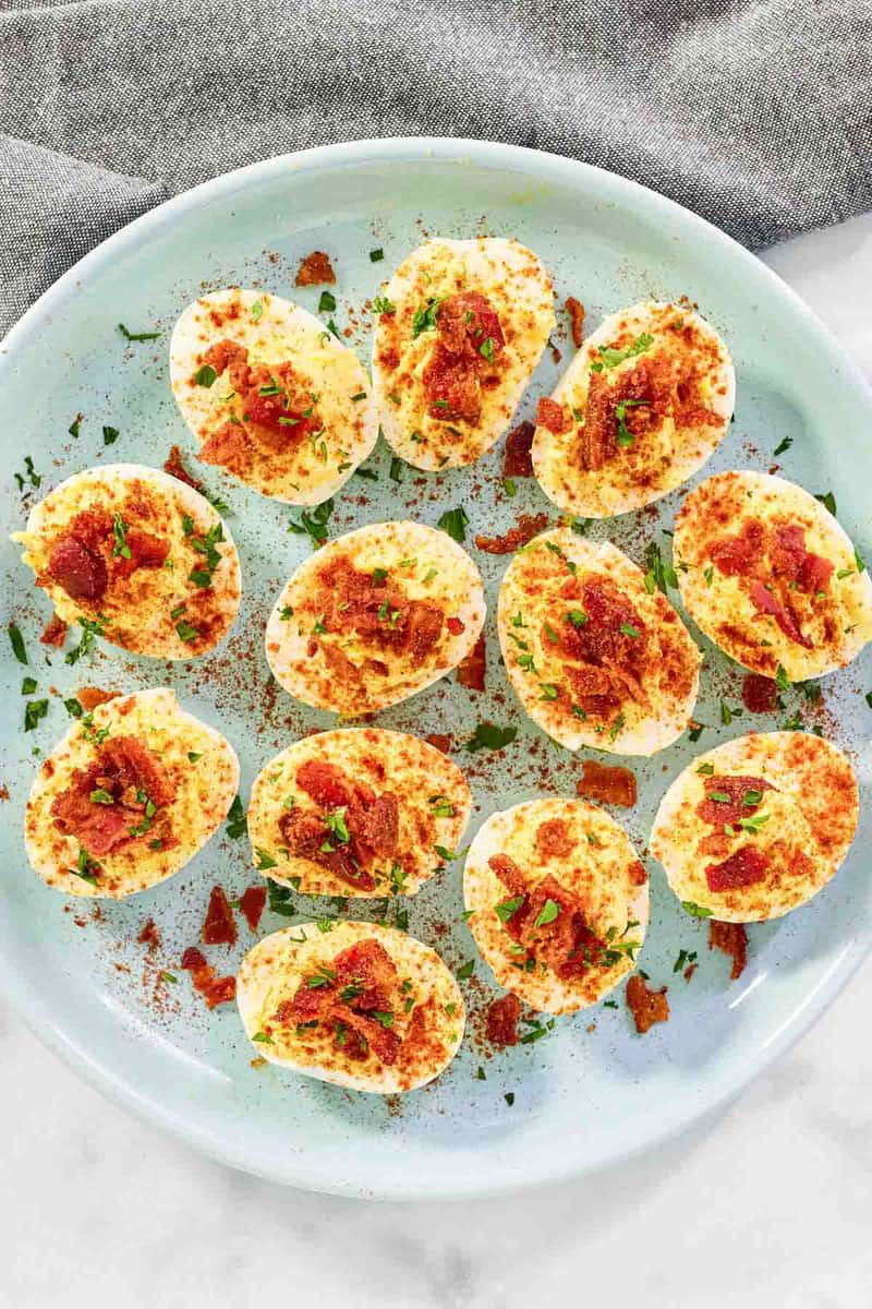Brown sugar candied bacon bits on deviled eggs.