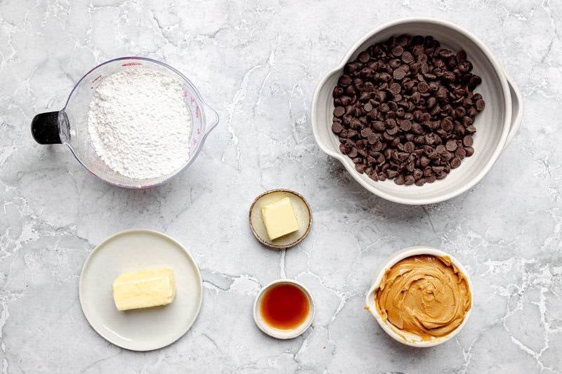 Powdered sugar, chocolate chips, butter, vanilla, and peanut butter.