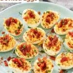 A platter of deviled eggs topped with brown sugar candied bacon bits.
